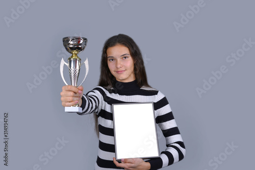 woman winner holding cup and blank frame mock-up