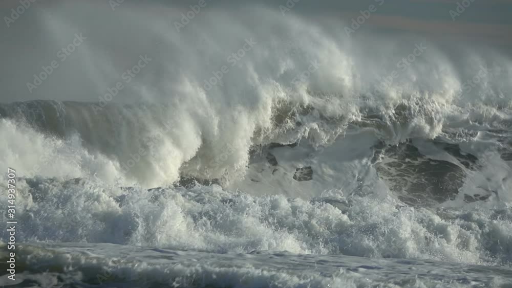 Sea big wave sea spray foam blue sky