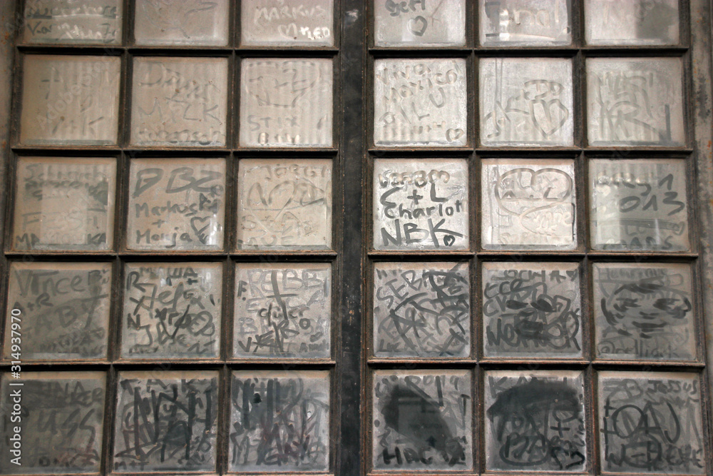 Paintings in a dirty window Paintings in a dirty window