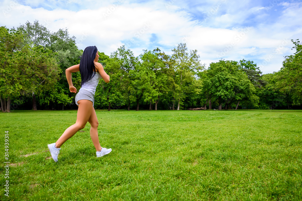 Beautiful young sporty girl in a park Beautiful young sporty girl in a park