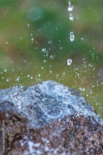 water flowing on a stone