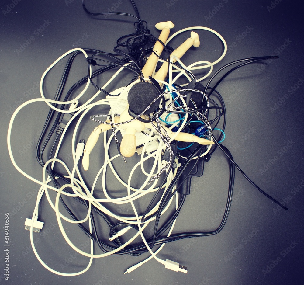 Jumbled mess of cords, wires, headphones Jumbled mess of cords, wires, headphones