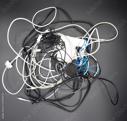 Jumbled mess of cords, wires, headphones