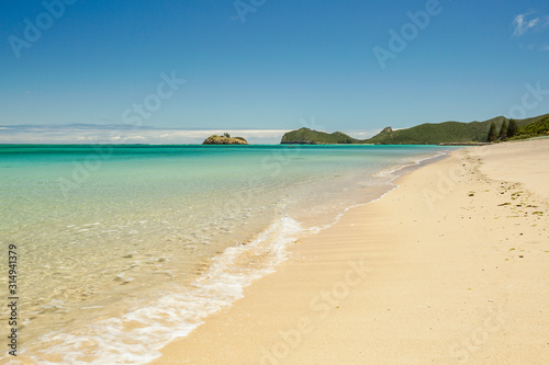 Northern beach of Lord Howe Island on a perfect blue sky summers day © Zorro Stock images