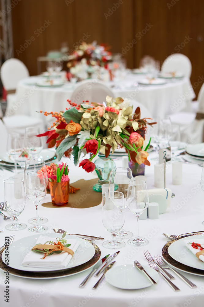 Table setting with fork, knife, plates and glass Table setting with fork, knife, plates and glass