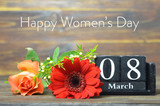 Happy Womens Day card. Retro wooden calendar and flowers