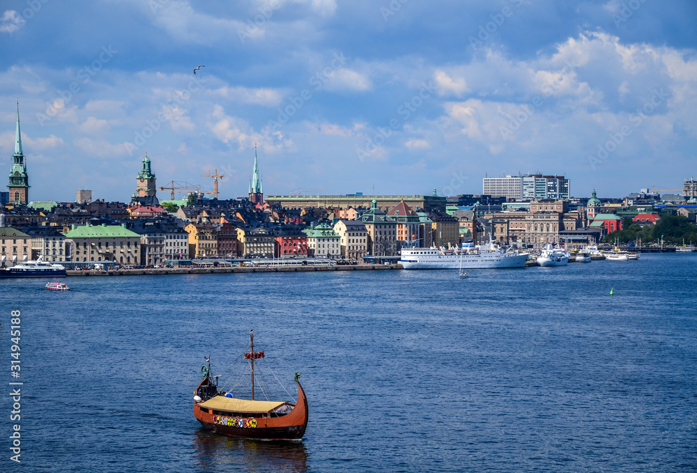 Obraz premium Stylized Viking ship Drakkar on the background of the panoramic view of Stockholm. Sweden