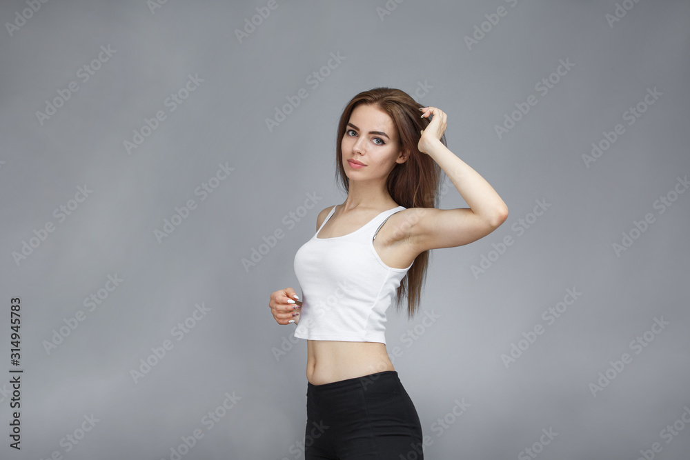 girl posing on gray background girl posing on gray background