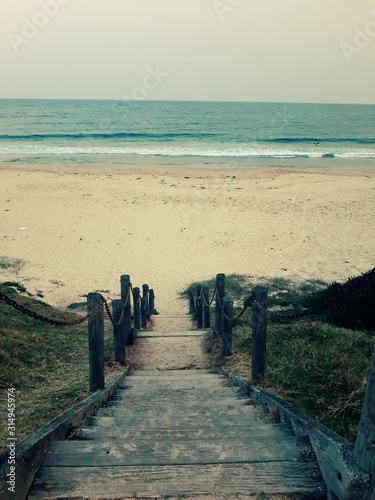 stairs down to a glamorous beach