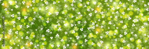 St.Patrick's Day green vector background with clover leaves