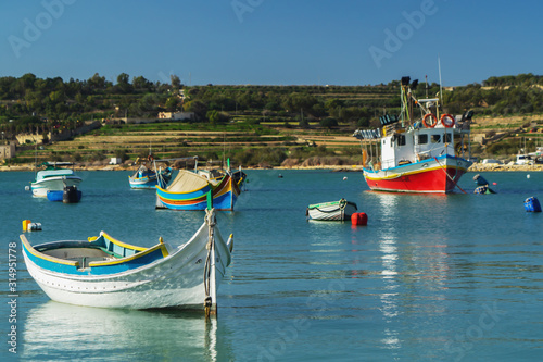 A luzzu is a traditional fishing boat from the Maltese islands. Painted in bright colours, luzzus have existed sin