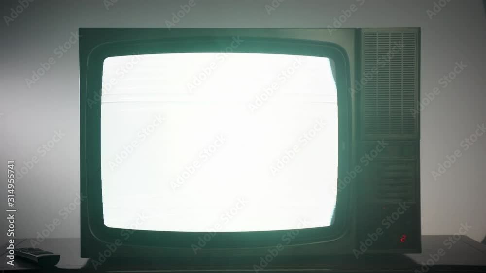 Old vintage television with blinking screen, oldfashioned black TV