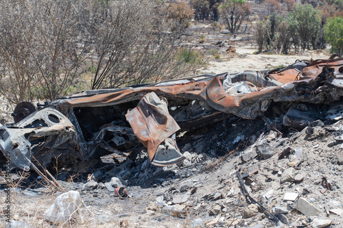 Abandoned car burnt in the bushfire photo