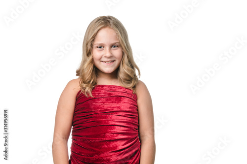 Little girl posing with red velvet dress on white background