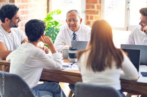 Group of business workers working together at the office