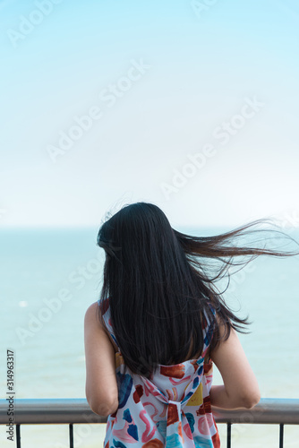 Woman relax at sea viewpoint in concept travel