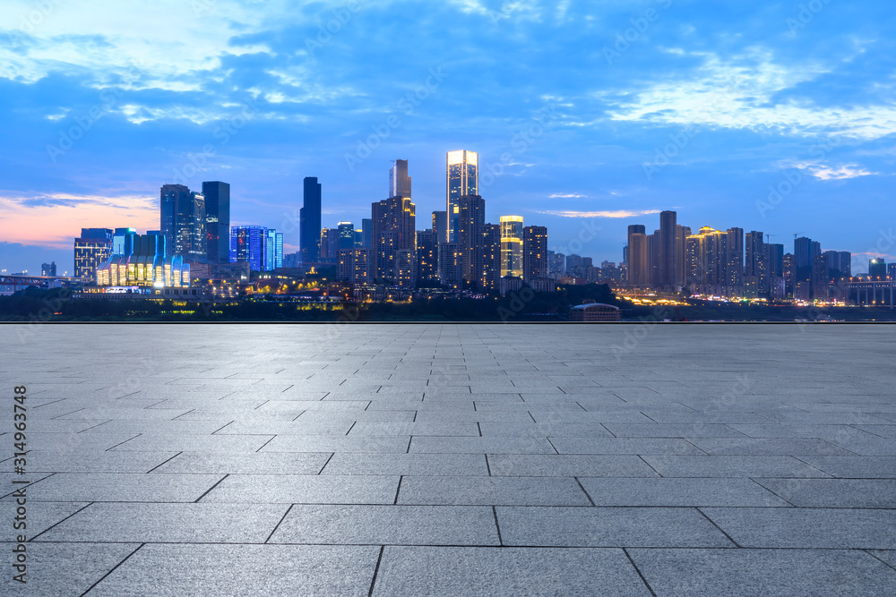 Empty square floor and city skyline with buildings in Chongqing at night,China. Empty square floor and city skyline with buildings in Chongqing at night,China.