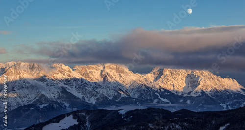 Panoramic sunset view moon Saalbach skiing Mountain moonrise dark mood