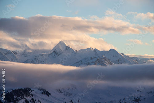 Kitzsteinhorn Snowy mountains sunset landscape view dark mood weather clouds © Andreas