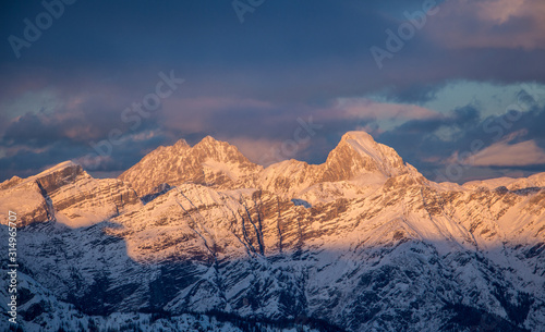 Mountain portrait Birnhorn Saalbach sunset purple light clouds reflecting the mountainscape