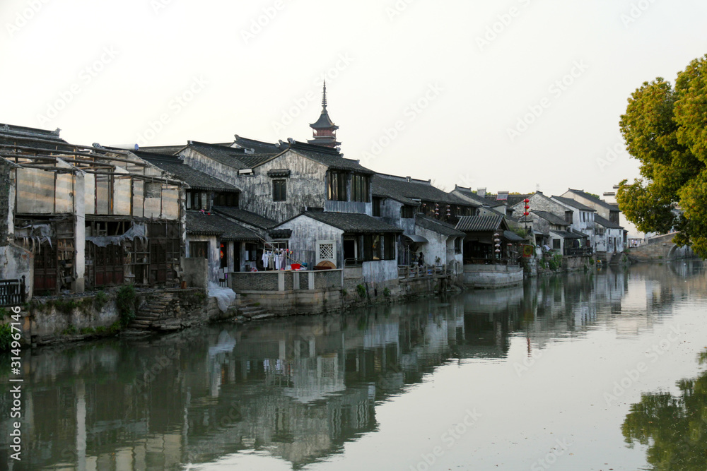 Ancient houses and beautiful reflections by the water on the Jiangnan Canal in China