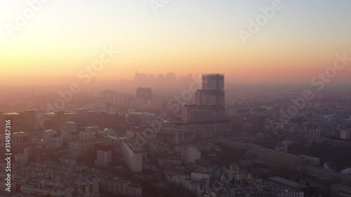 Sunset over Paris justice tribunal glass modern building la Defense business area in background France 