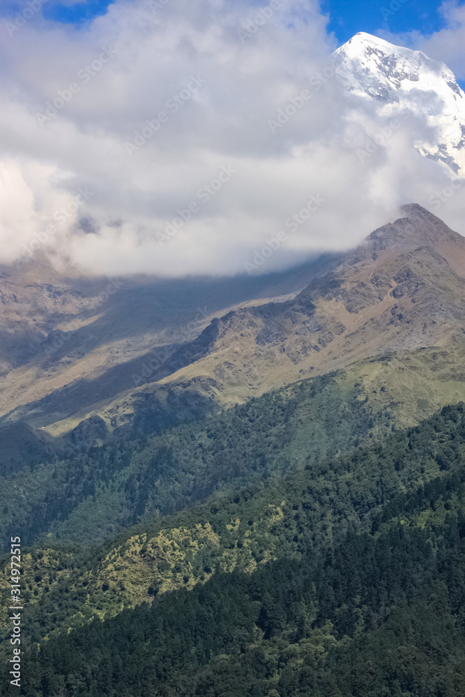 Snow-covered Mountain With Blue Sky, Cloud and Fog Snow-covered Mountain With Blue Sky, Cloud and Fog