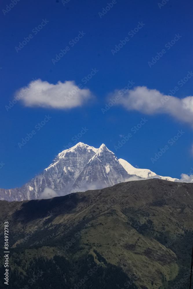 Snow-covered Mountain With Blue Sky, Cloud and Fog Snow-covered Mountain With Blue Sky, Cloud and Fog