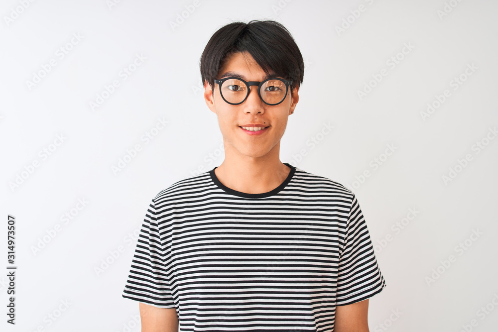 Chinese man wearing glasses and navy striped t-shirt standing over isolated white background with a happy and cool smile on face. Lucky person. Chinese man wearing glasses and navy striped t-shirt standing over isolated white background with a happy and cool smile on face. Lucky person.