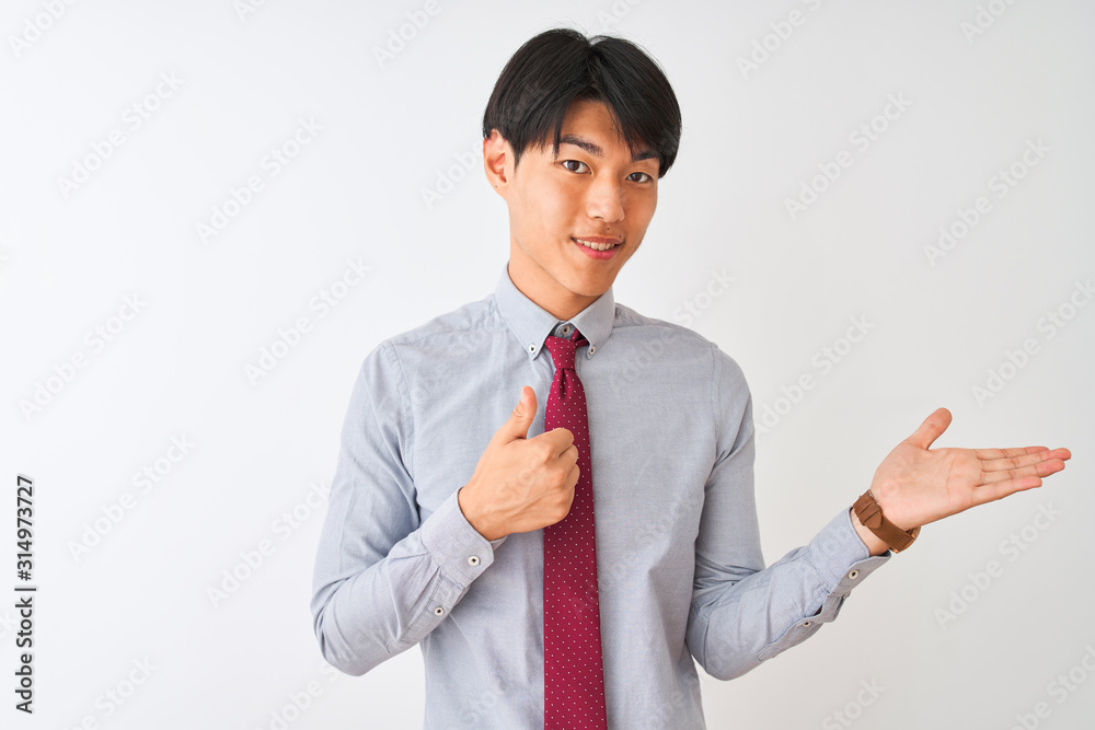 Chinese businessman wearing elegant tie standing over isolated white background Showing palm hand and doing ok gesture with thumbs up, smiling happy and cheerful Chinese businessman wearing elegant tie standing over isolated white background Showing palm hand and doing ok gesture with thumbs up, smiling happy and cheerful