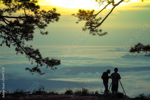 silhouette of mans in sunrise mountain morning
