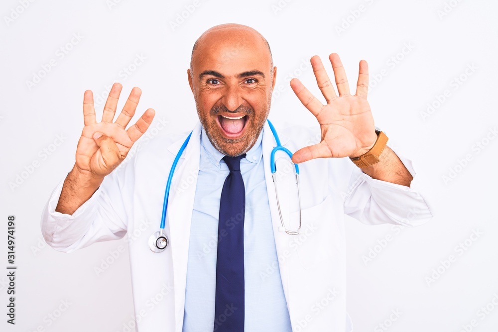 Middle age doctor man wearing stethoscope and tie standing over isolated white background showing and pointing up with fingers number nine while smiling confident and happy.