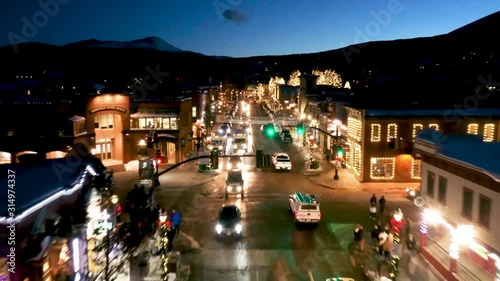 Aerial drone footage over Main Street in the ski town of Breckenridge, Colorado at night. photo