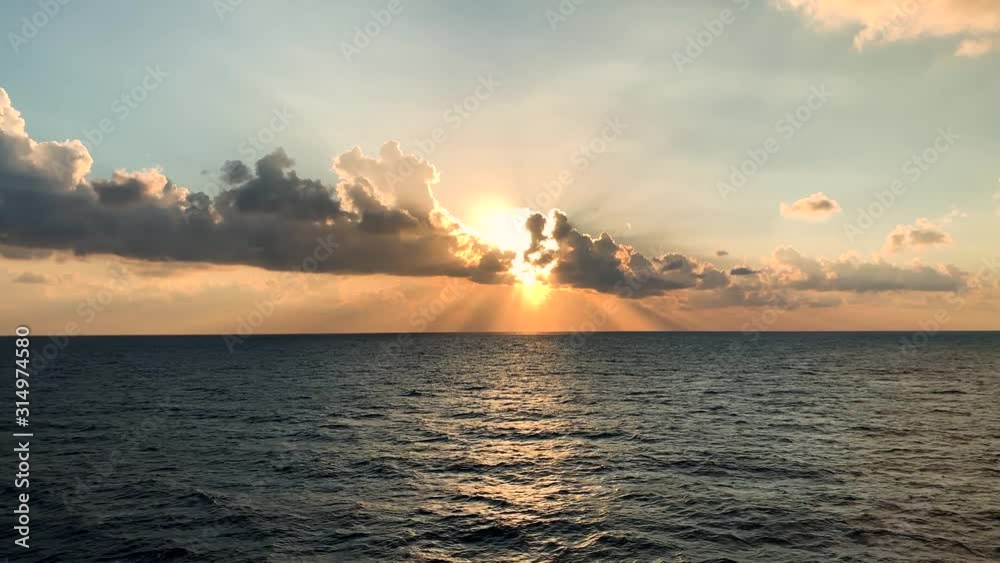 horizon with sunset and clouds crossing the sky