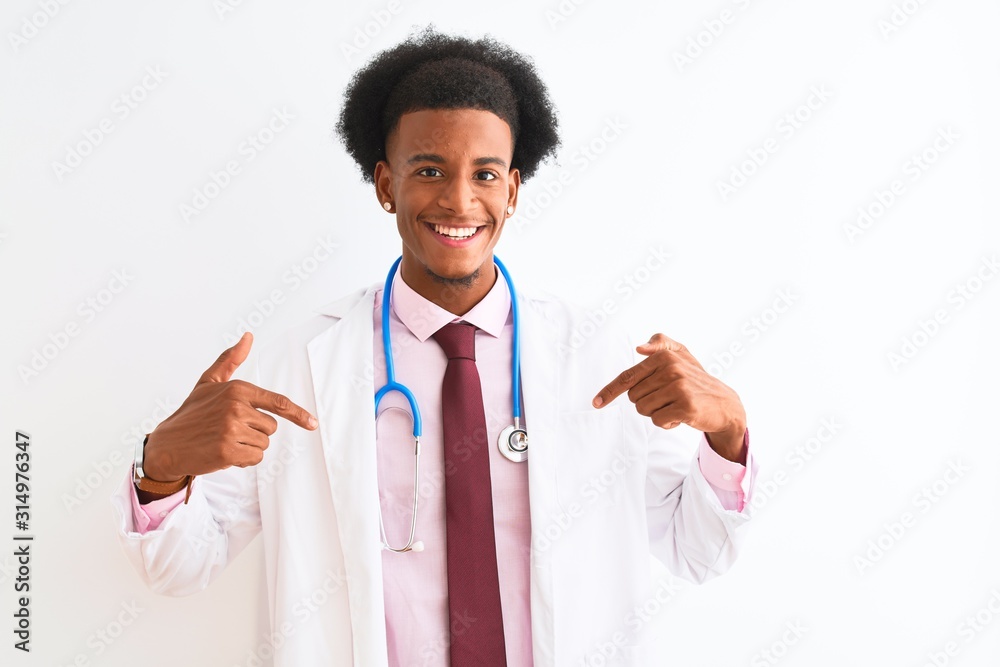 Young african american doctor man wearing sthetoscope over isolated white background looking confident with smile on face, pointing oneself with fingers proud and happy. Young african american doctor man wearing sthetoscope over isolated white background looking confident with smile on face, pointing oneself with fingers proud and happy.