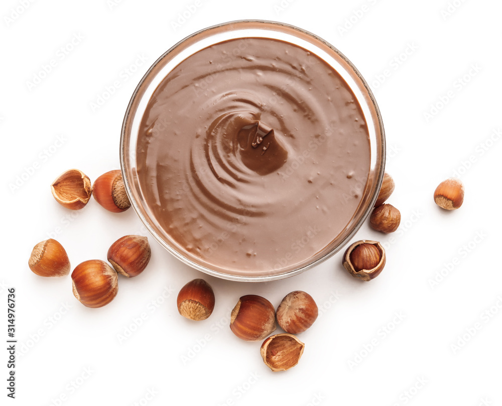 Tasty chocolate paste with hazelnuts on white background Tasty chocolate paste with hazelnuts on white background