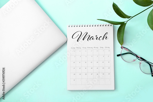Calendar with laptop and ey...