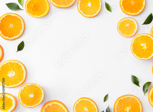 Frame made of sweet oranges on white background