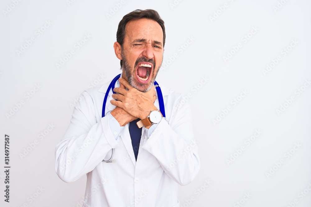Middle age doctor man wearing coat and stethoscope standing over isolated white background shouting and suffocate because painful strangle. Health problem. Asphyxiate and suicide concept. Middle age doctor man wearing coat and stethoscope standing over isolated white background shouting and suffocate because painful strangle. Health problem. Asphyxiate and suicide concept.
