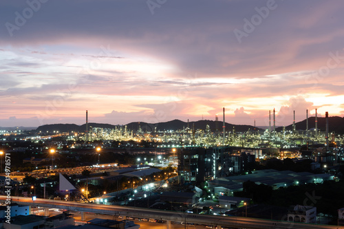 Oil refinery and petrochemical plants Steel pipe equipment at sunrise background