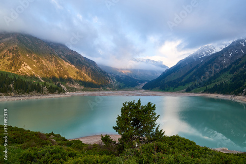 Big Almaty lake in the mountains. Blurred water effect. Ile-Alatau National Park. Kazakhstan.