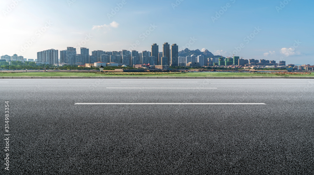 Road surface and urban architectural landscape skyline