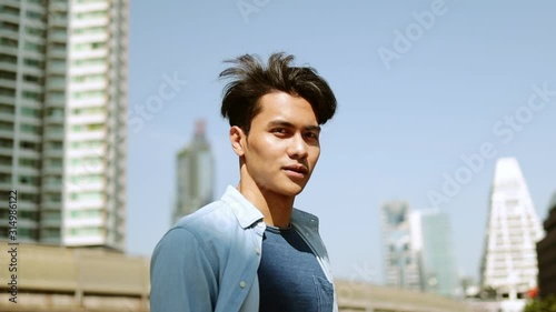 Portrait of a Urban Young Man. Slow Motion. Front View. Model Looking at Camera. Dolly Zoom in