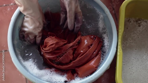Cloth Cleaning Concept. Washing Clothes by Hands on the Basin. Slow Motion Shot, Top View