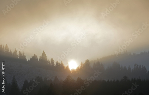 sunset after mountain with fog