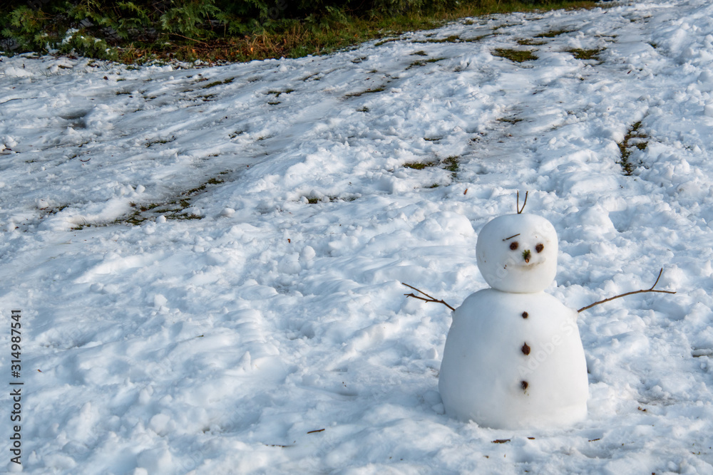 A picture of a snowman on snow-covered ground. Burnaby Mountain BC Canada  Stock Photo