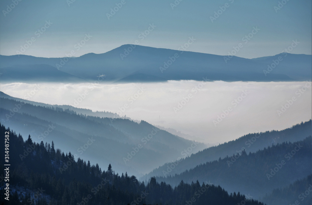 the fog between the mountains