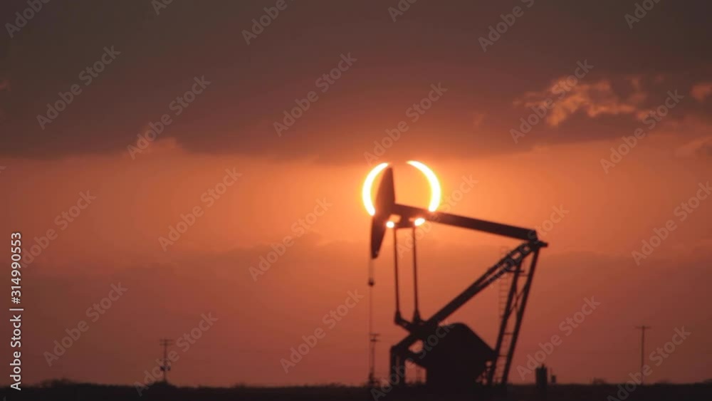 Solar Eclipse Time Lapse with an oil industry pump jack. Solar Eclipse Time Lapse with an oil industry pump jack.