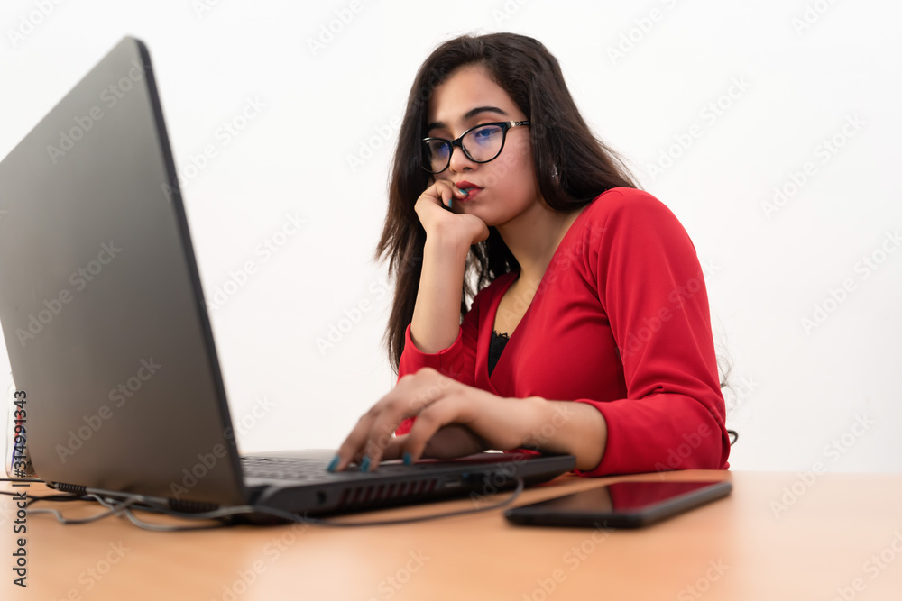 Young pretty business woman with notebook in the office