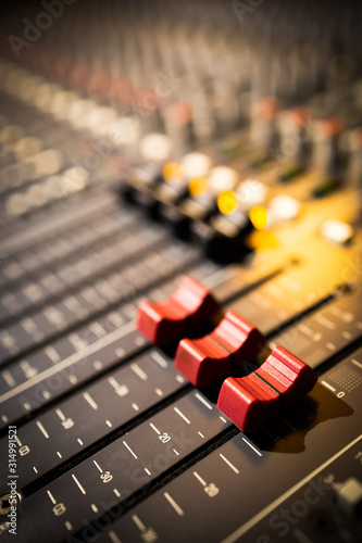 closeup red audio mixing console fader